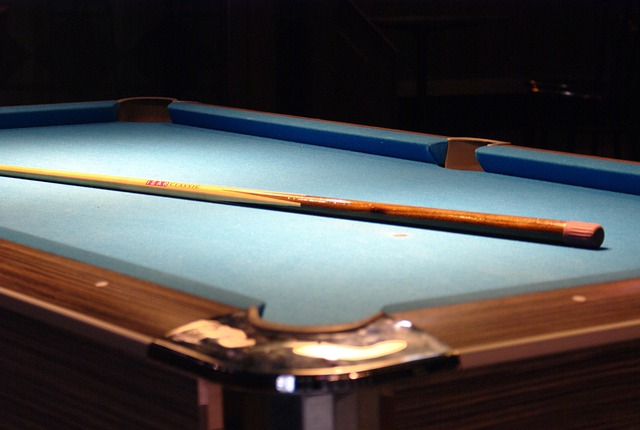 friends playing billiards