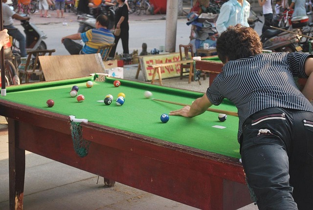 friends playing billiards